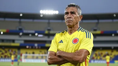 A 35-year-old Colombian national team midfielder with a rugged build and graying temples, his weathered face set in a...