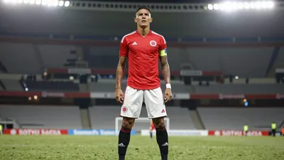 A photorealistic image of an anonymous Colombian national team player, wearing a red jersey with white shorts and black...